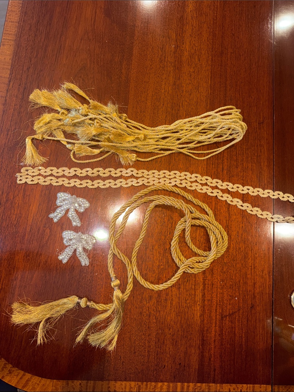 Gold Braided Rope tassel and dozen gold tie backs   Gold Venice trim, silver bow